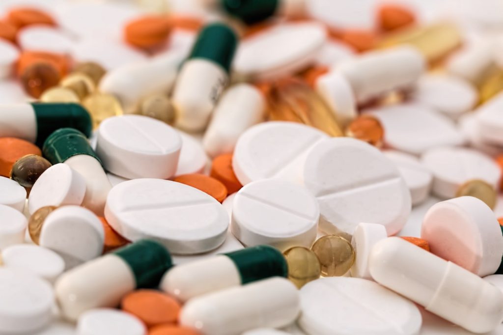 Several pills laid out on a table