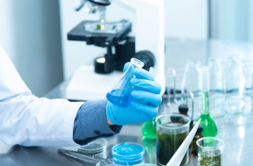 Doctor holding test tube in lab