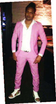 Tristan Palmer wearing a pink suit